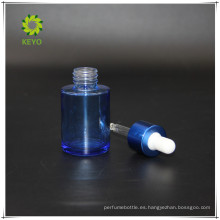 La venta caliente 30ml compone el azul que empaqueta la botella de cristal cosmética vacía transparente colorida del gotero con el cuentagotas de goma